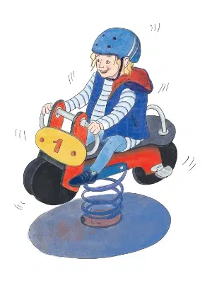 Enfant sur une moto à ressort